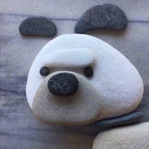 رسم كلب بالحجارة